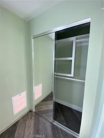 a hallway with wooden floor
