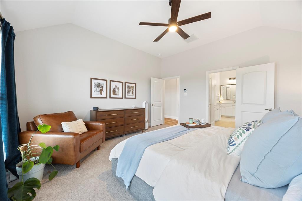 809 Mildren Lane Fate, TX 75087 - Photo 12 of 32 See the entry into the primary bath. Notice the vaulted ceiling
