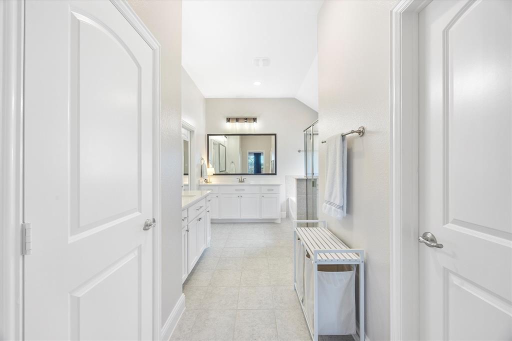 809 Mildren Lane Fate, TX 75087 - Photo 13 of 32 Lovely spa like bathroom, tiled floors, and refreshing light.