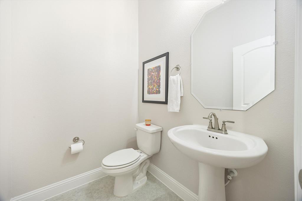 809 Mildren Lane Fate, TX 75087 - Photo 20 of 32 A half bath provides convenience for guests