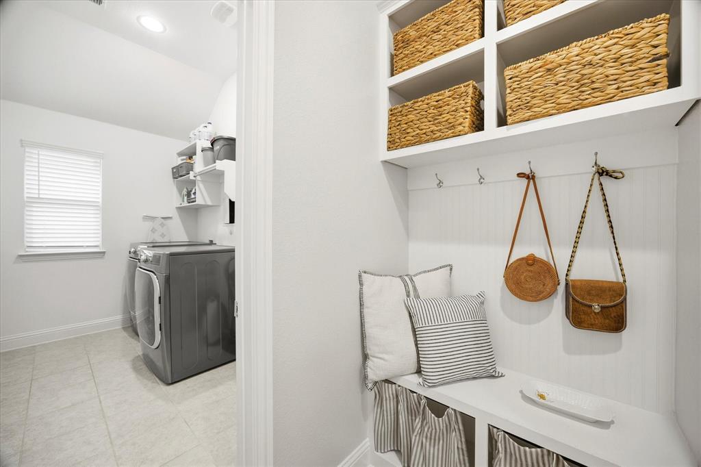 809 Mildren Lane Fate, TX 75087 - Photo 21 of 32 A very convenient mudroom area that is across from the garage and next to the laundry room.