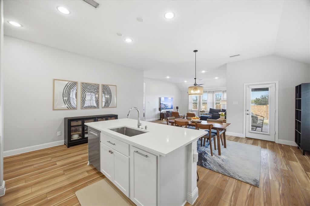 809 Mildren Lane Fate, TX 75087 - Photo 6 of 32 A look from the kitchen into the dining area and beyond