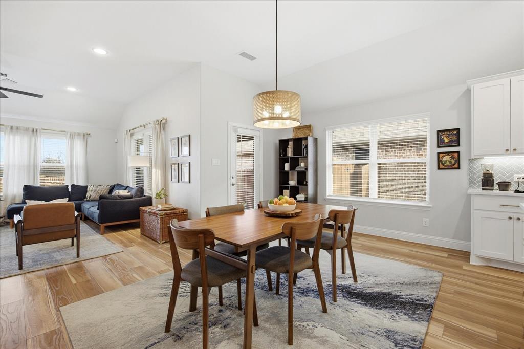 809 Mildren Lane Fate, TX 75087 - Photo 8 of 32 Dining room area with a lovely decorative light fixture.
