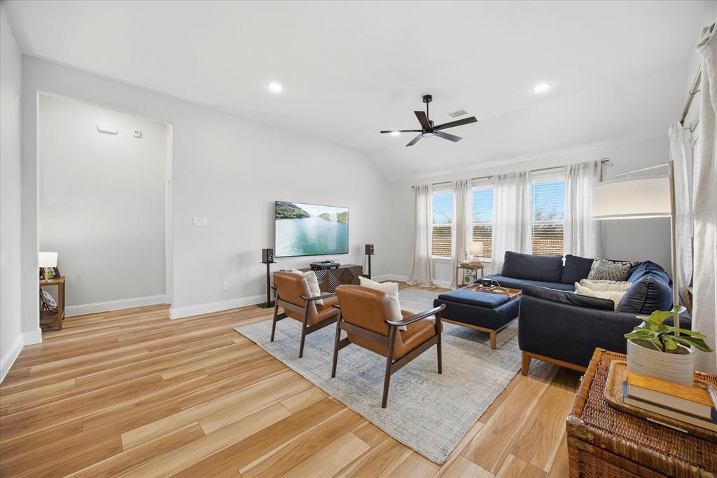 809 Mildren Lane Fate, TX 75087 - Photo 10 of 32 You can see the entry to the primary bedroom and bath.