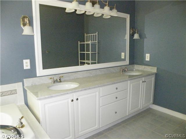 21810 Sappony Road Moseley, VA 23120 - Photo 10 of 24 a bathroom with a sink and a mirror