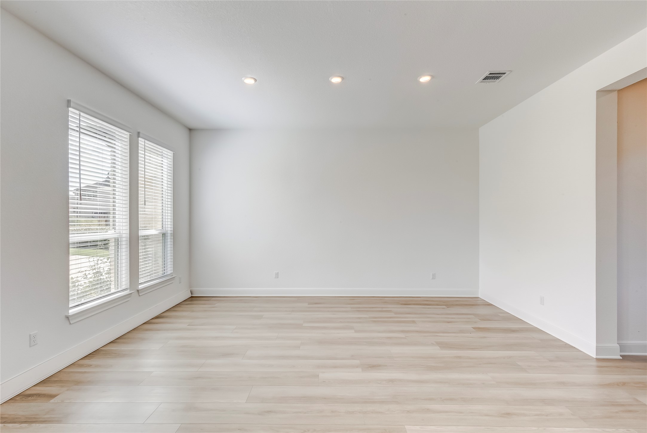 462 Old Stone Road Austin, TX 78737 - Photo 17 of 39 wooden floor in an empty room with a window
