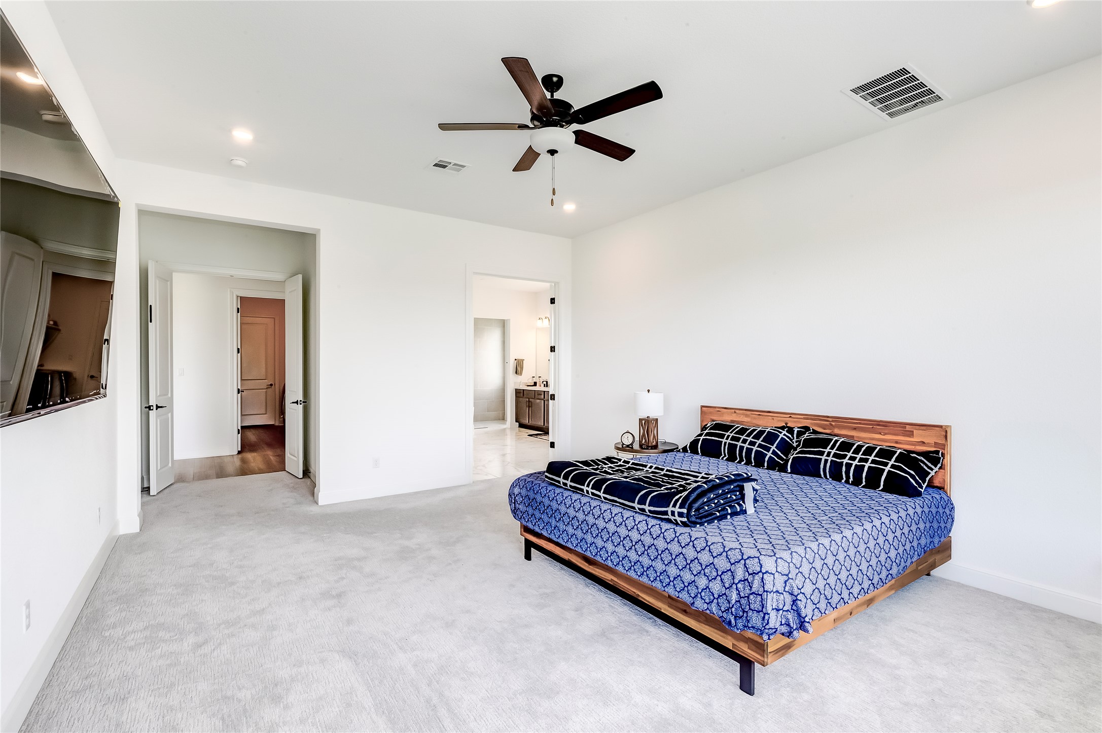 462 Old Stone Road Austin, TX 78737 - Photo 22 of 39 a bedroom with bed and ceiling fan