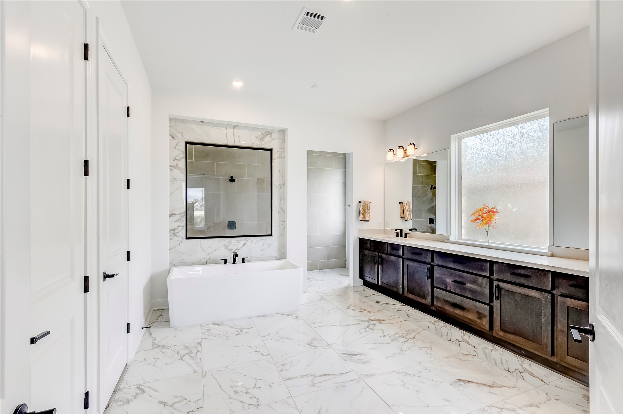 462 Old Stone Road Austin, TX 78737 - Photo 26 of 39 a spacious bathroom with a double vanity sink mirror and bathtub