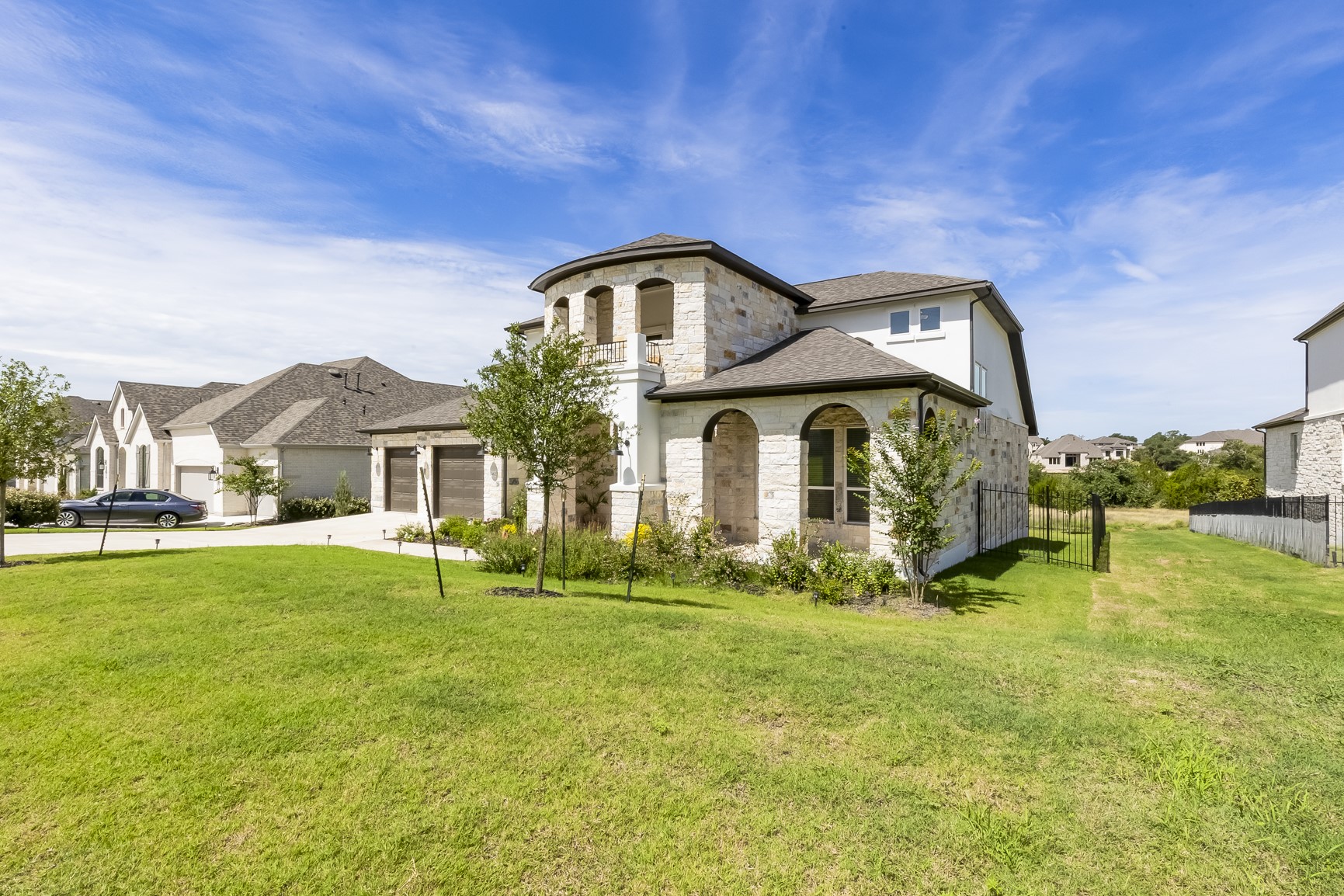462 Old Stone Road Austin, TX 78737 - Photo 3 of 39 a front view of a house with a yard