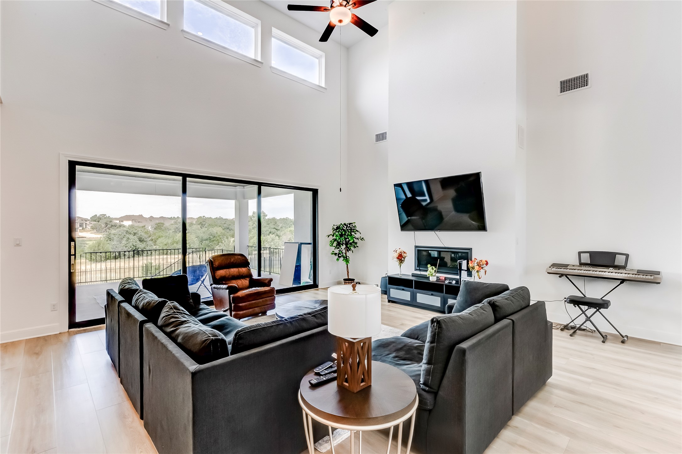 462 Old Stone Road Austin, TX 78737 - Photo 7 of 39 a living room with furniture and a flat screen tv