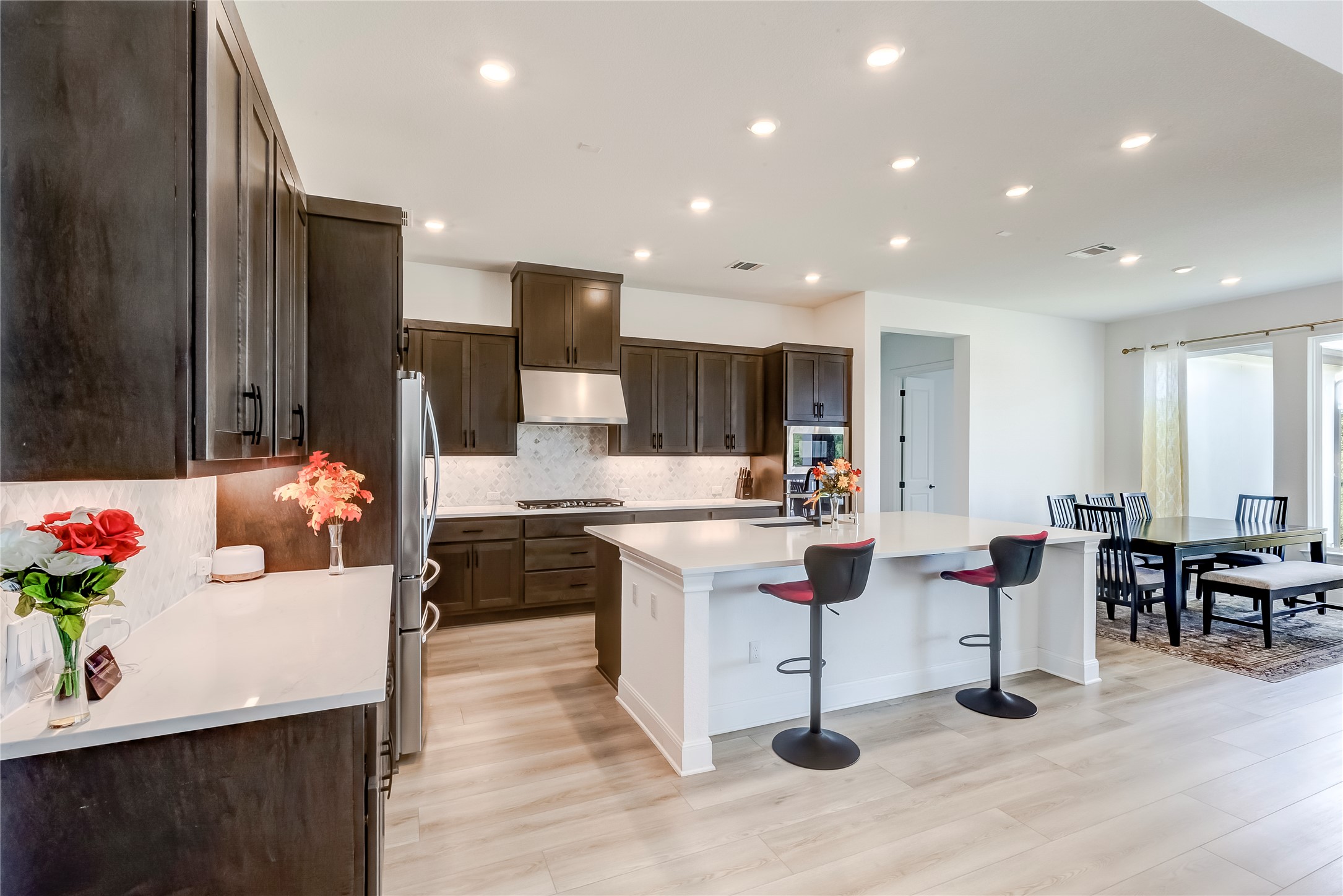 462 Old Stone Road Austin, TX 78737 - Photo 10 of 39 a living room with stainless steel appliances kitchen island granite countertop furniture and a kitchen view