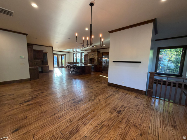 4536 North 475 East Provo, UT 84604 - Photo 4 of 65 Spacious open-concept interior featuring textured wood-finish flooring, recessed ceiling lighting, and a contemporary linear chandelier