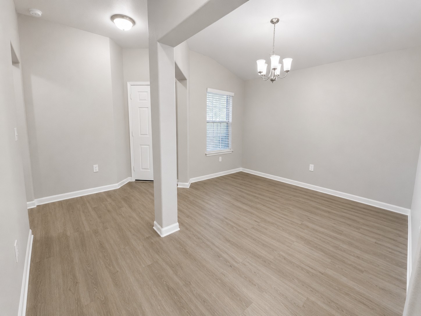 228 Avalanche Avenue Georgetown, TX 78626 - Photo 3 of 16 wooden floor in an empty room with a window