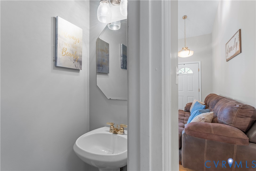 3363 Darbytown Road Henrico, VA 23231 - Photo 11 of 33 a bathroom with a toilet sink and mirror