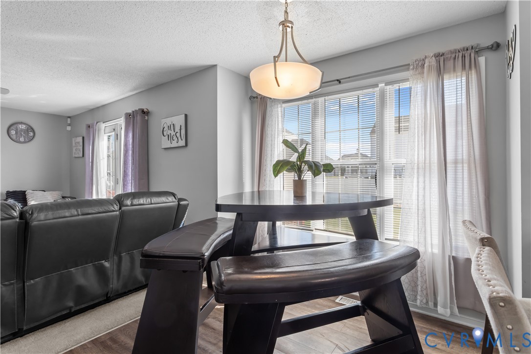 3363 Darbytown Road Henrico, VA 23231 - Photo 14 of 33 a view of a dining room with furniture window and wooden floor