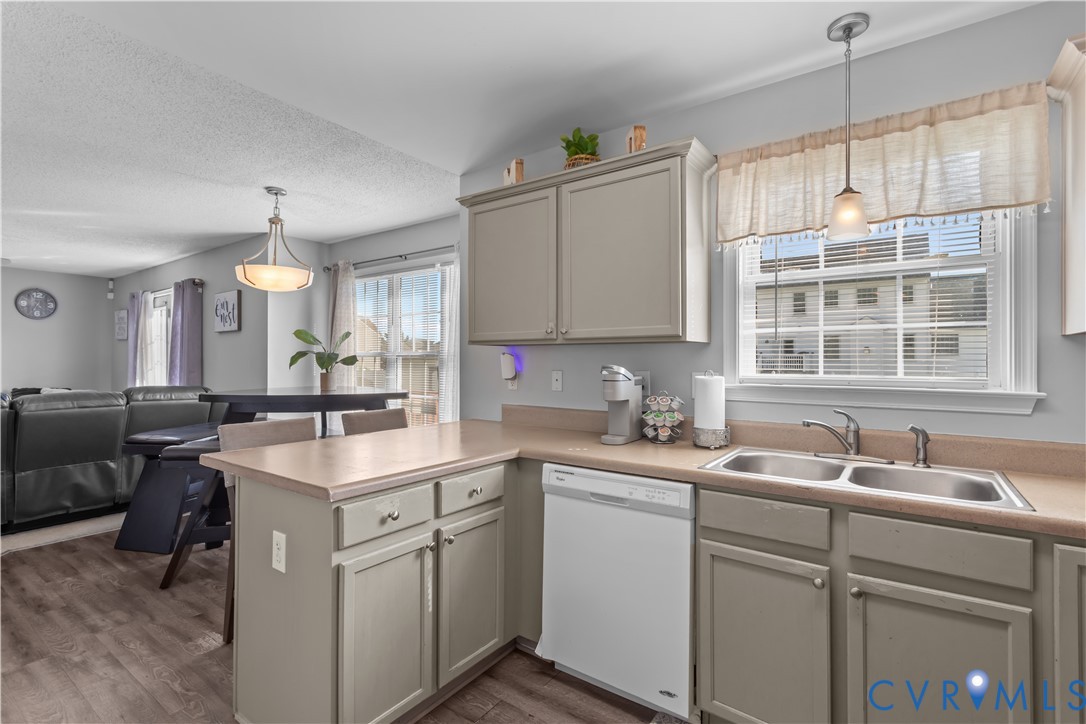 3363 Darbytown Road Henrico, VA 23231 - Photo 16 of 33 a kitchen with a sink stove and cabinets