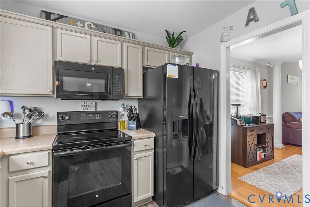 3363 Darbytown Road Henrico, VA 23231 - Photo 18 of 33 a kitchen with granite countertop a refrigerator stove and microwave