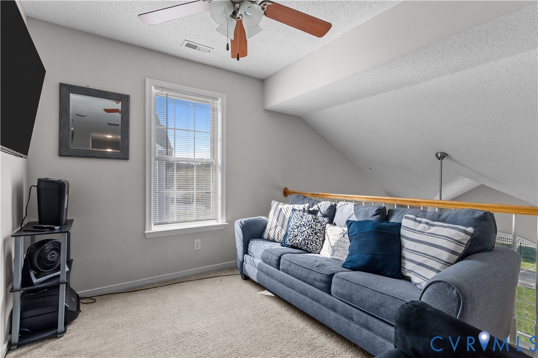 3363 Darbytown Road Henrico, VA 23231 - Photo 20 of 33 a living room with furniture a flat screen tv and a window