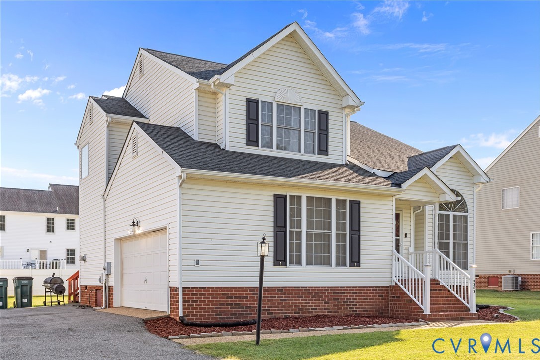 3363 Darbytown Road Henrico, VA 23231 - Photo 2 of 33 a view of a white house next to a yard with wooden fence