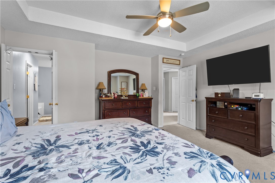 3363 Darbytown Road Henrico, VA 23231 - Photo 23 of 33 a bedroom with a bed and a flat screen tv in it