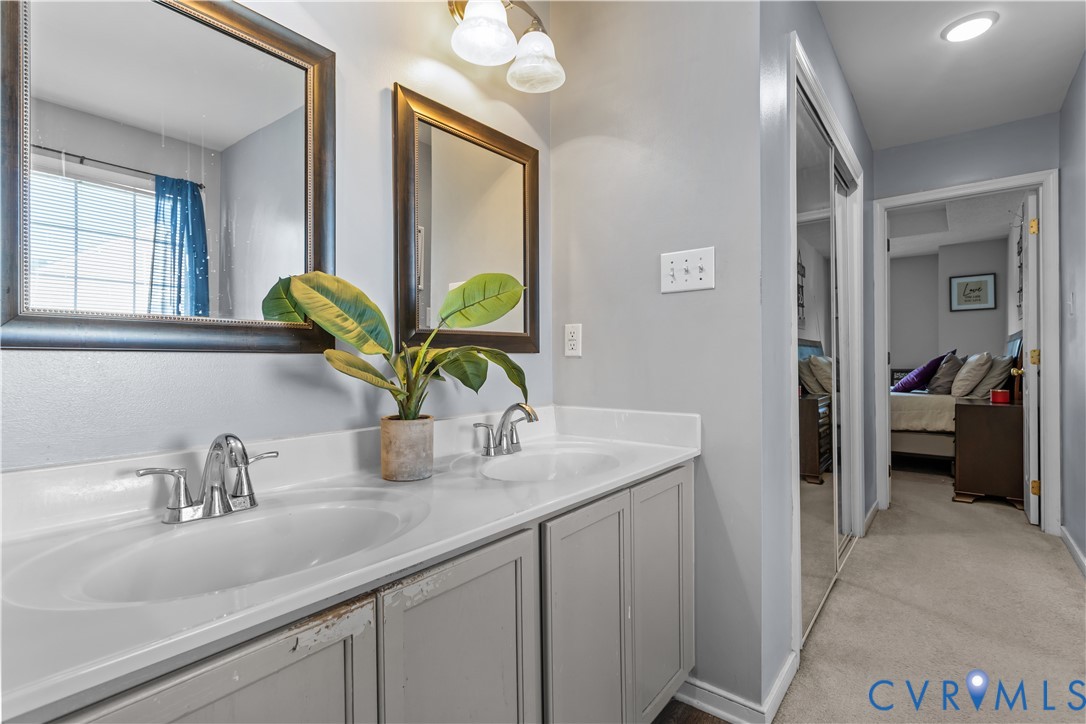 3363 Darbytown Road Henrico, VA 23231 - Photo 24 of 33 a bathroom with a sink a vanity and a mirror