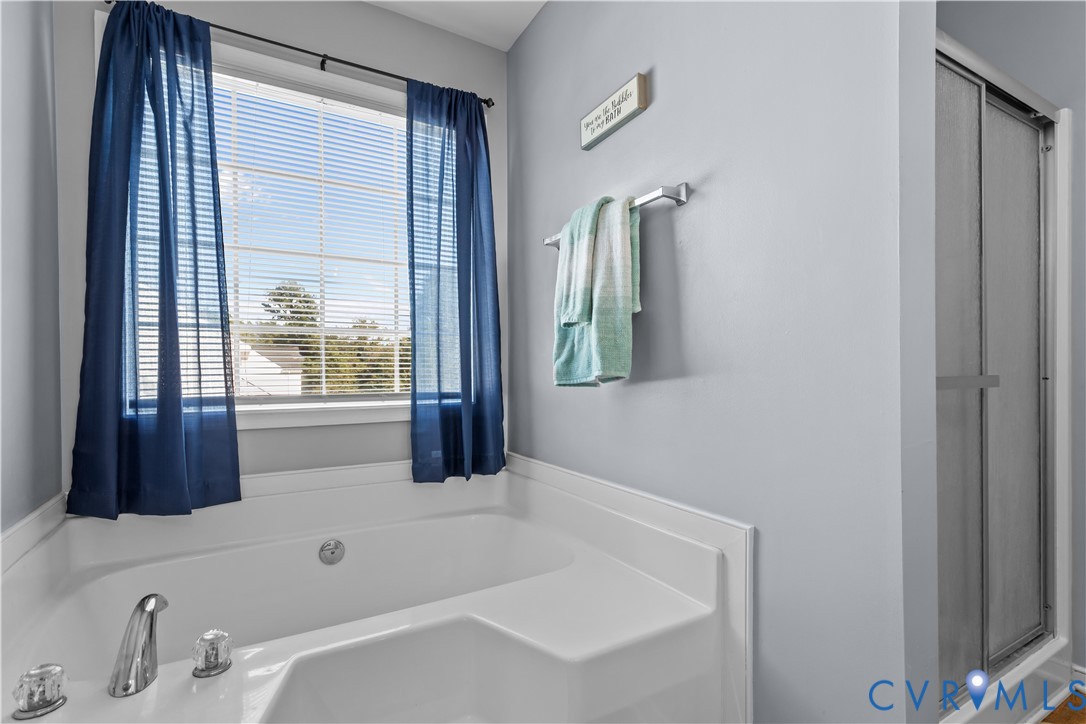 3363 Darbytown Road Henrico, VA 23231 - Photo 25 of 33 a bathroom with a tub sink and a mirror