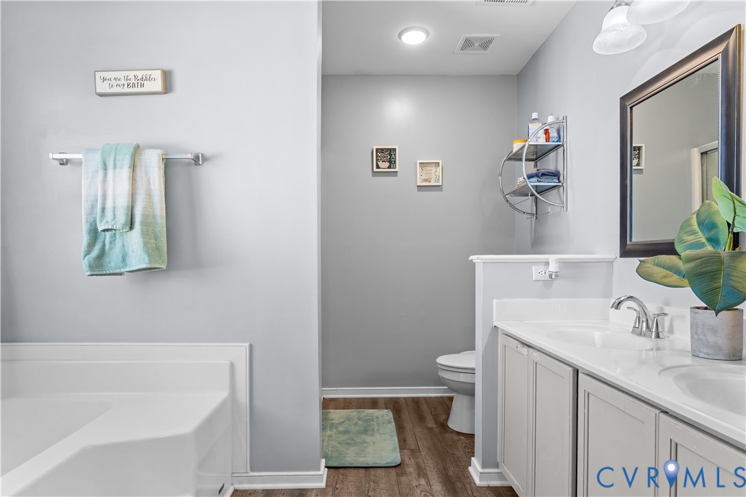 3363 Darbytown Road Henrico, VA 23231 - Photo 26 of 33 a bathroom with a sink a toilet and shower