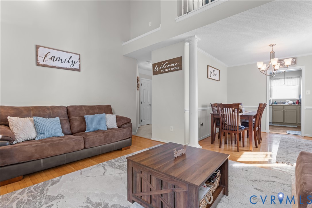 3363 Darbytown Road Henrico, VA 23231 - Photo 8 of 33 a living room with furniture and a chandelier