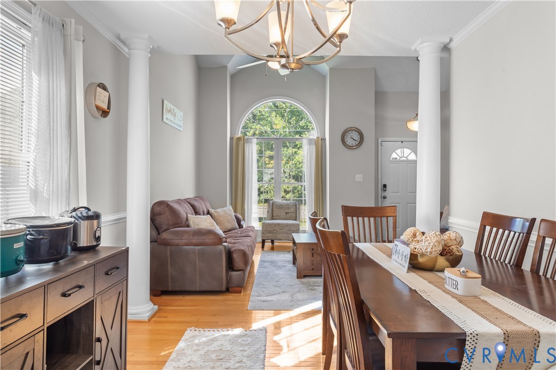 3363 Darbytown Road Henrico, VA 23231 - Photo 10 of 33 a living room with furniture chandelier and a large window