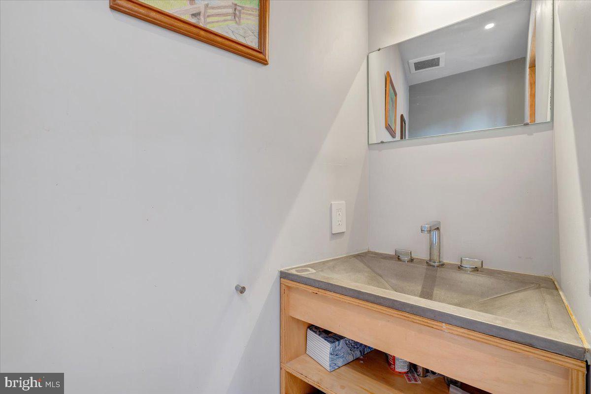722 Foley Ridge Road Stuart, VA 24171 - Photo 21 of 67 Sleek modern sink in a bright space.