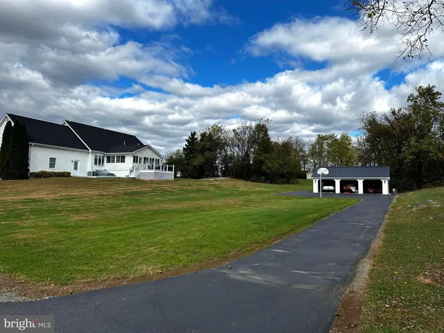a view of dining room with furniture wooden floor and chandelier