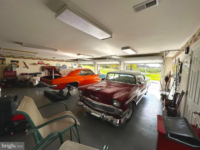 a view of a room with furniture and windows