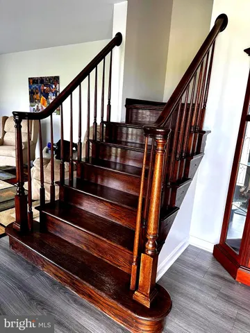 a room with wooden floor and windows