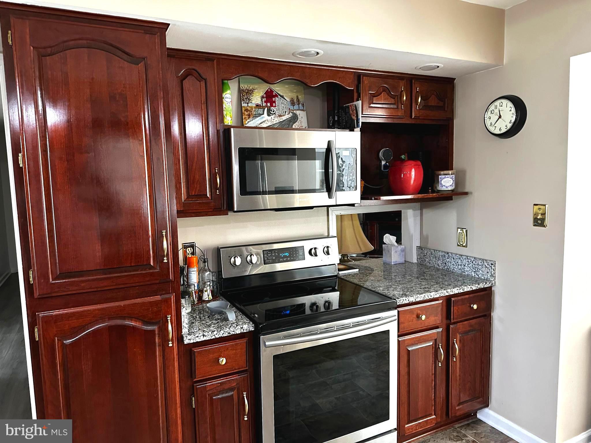 25 Mish Road Bunker Hill, WV 25413 - Photo 53 of 87 a kitchen with stainless steel appliances granite countertop a stove and a microwave