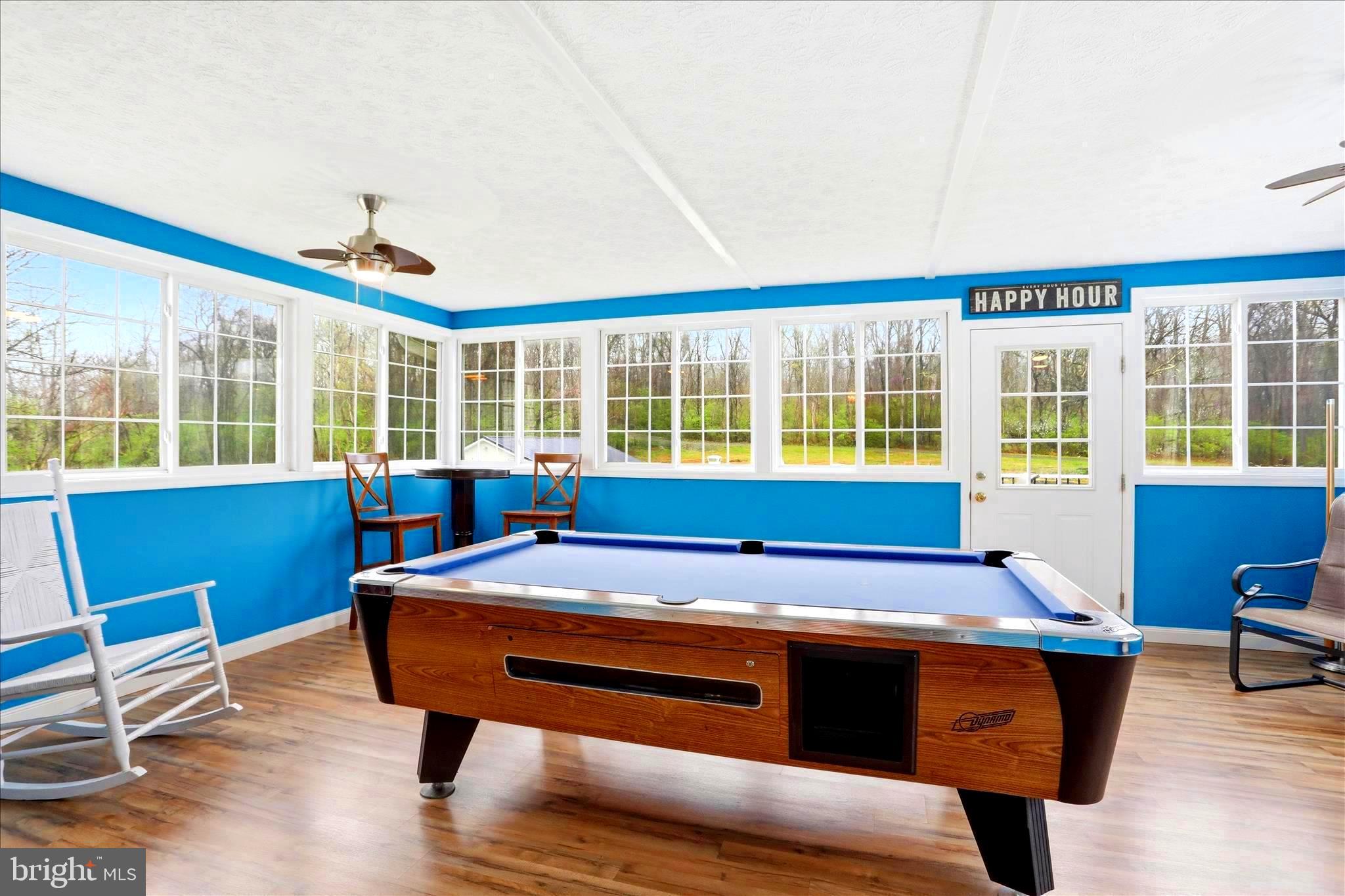 25 Mish Road Bunker Hill, WV 25413 - Photo 60 of 124 POOLTABLE / GAME ROOM WITH PLENTY OF NATURAL LIGHT