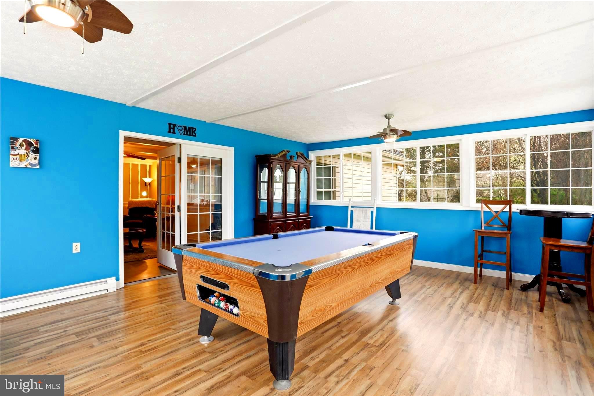 25 Mish Road Bunker Hill, WV 25413 - Photo 62 of 124 POOLTABLE / GAME ROOM WITH PLENTY OF NATURAL LIGHT