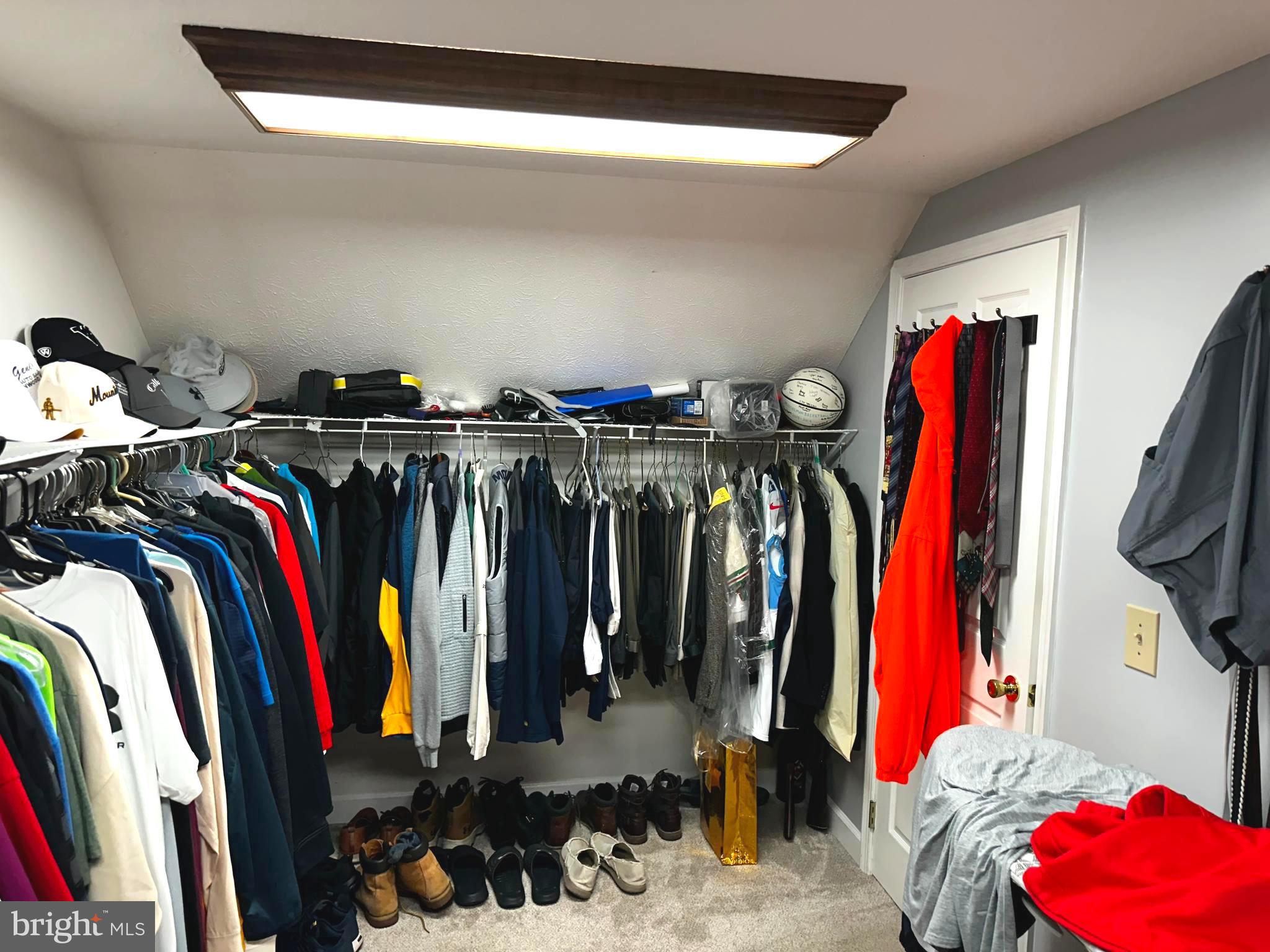 25 Mish Road Bunker Hill, WV 25413 - Photo 62 of 87 a view of walk in closet with clothes