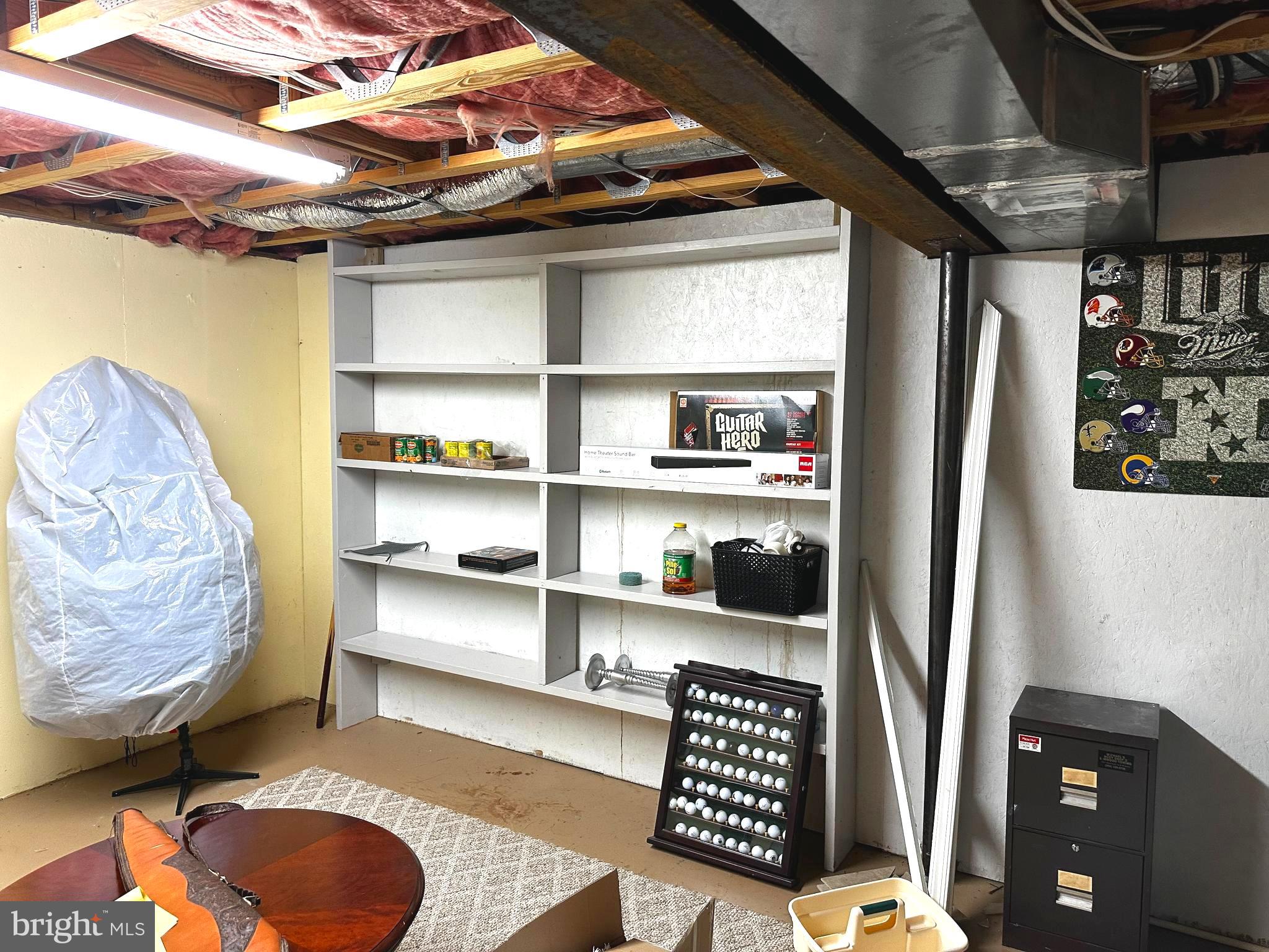 25 Mish Road Bunker Hill, WV 25413 - Photo 79 of 87 a room with furniture and a book shelf