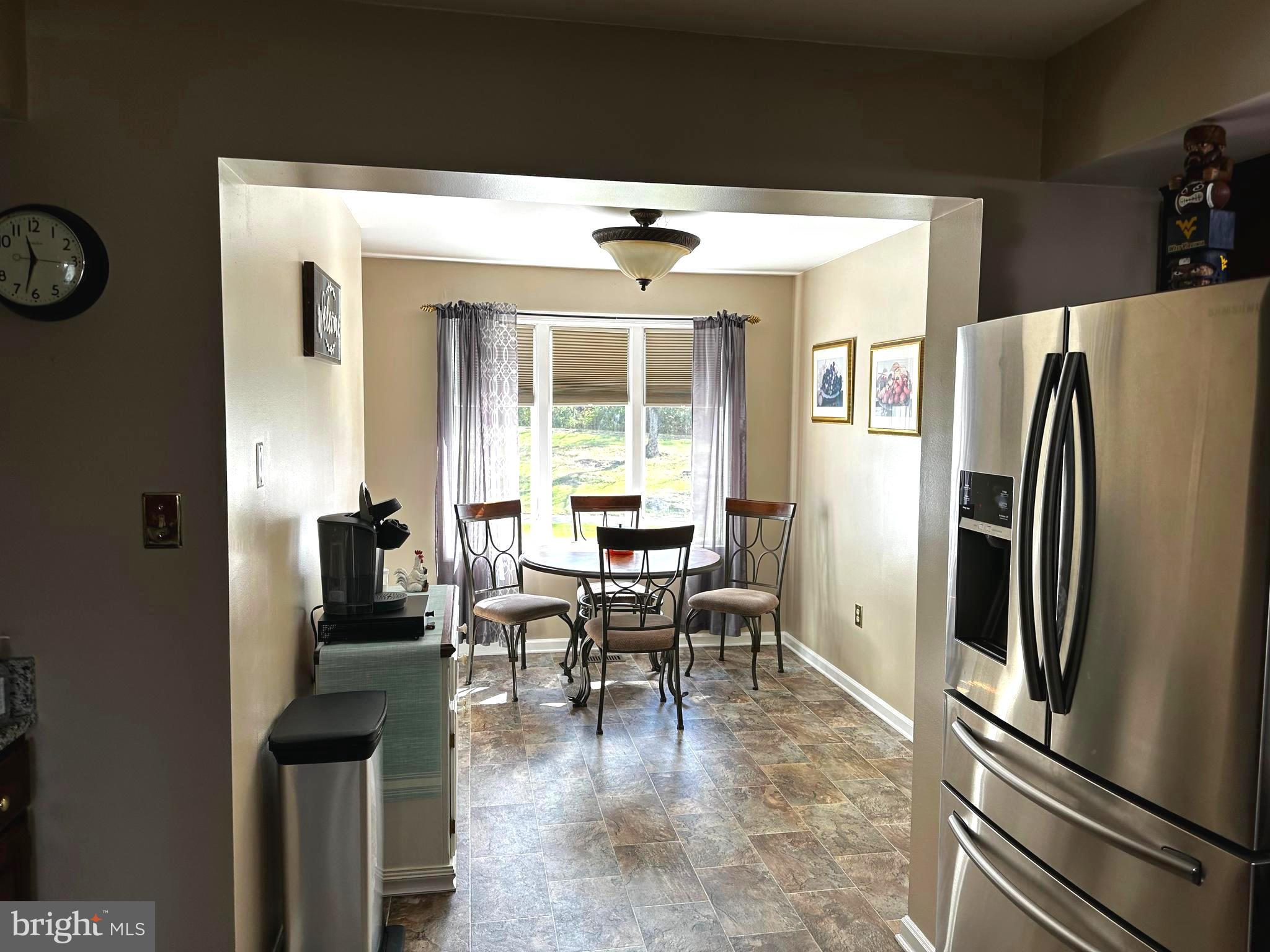 25 Mish Road Bunker Hill, WV 25413 - Photo 79 of 124 KITCHEN OPENS TO BRIGHT & CHEERY BREAKFAST ROOM