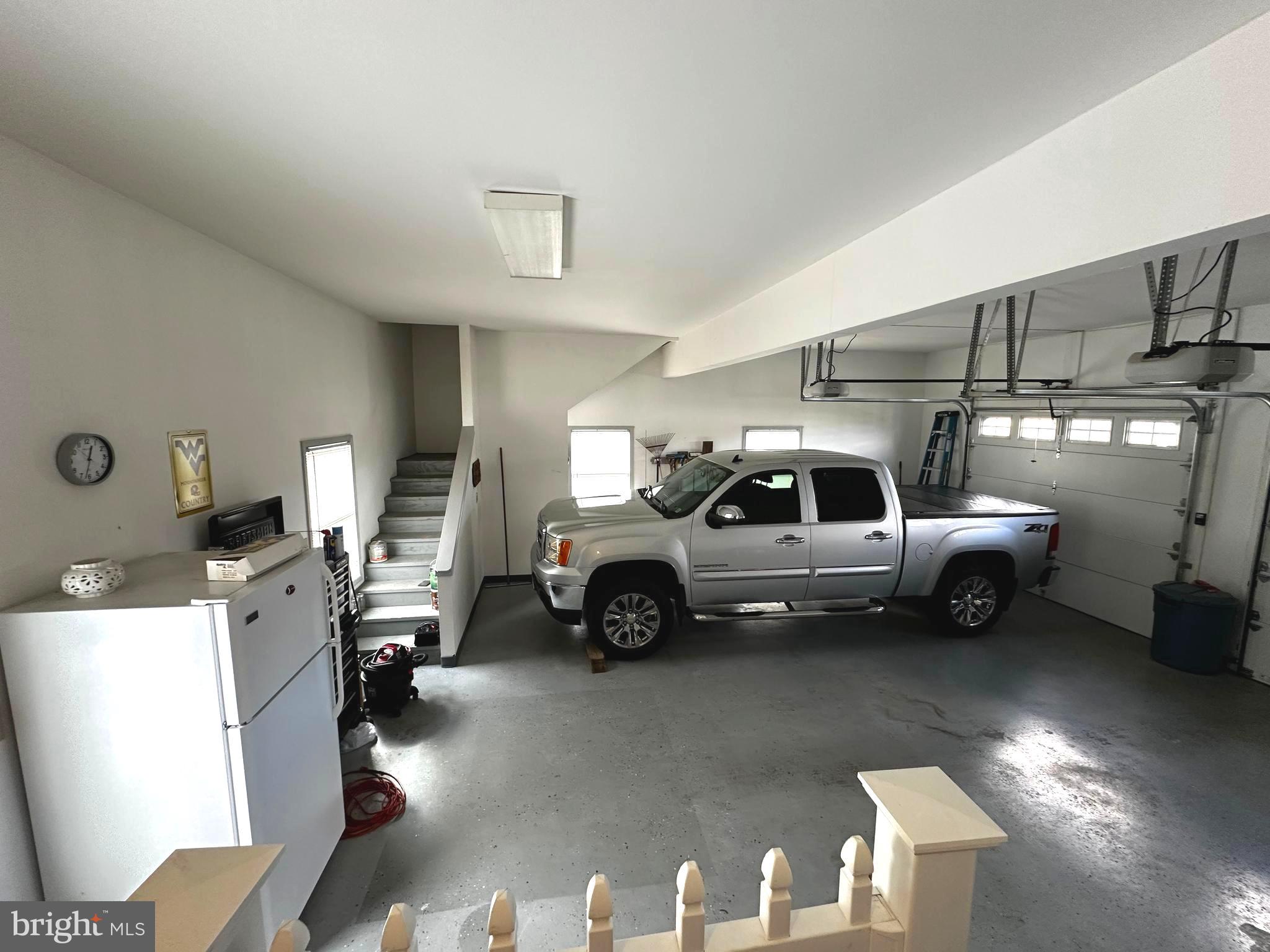 25 Mish Road Bunker Hill, WV 25413 - Photo 83 of 87 ATTACHED 2 CAR GARAGE w/ STAIRS TO ATTIC STORAGE