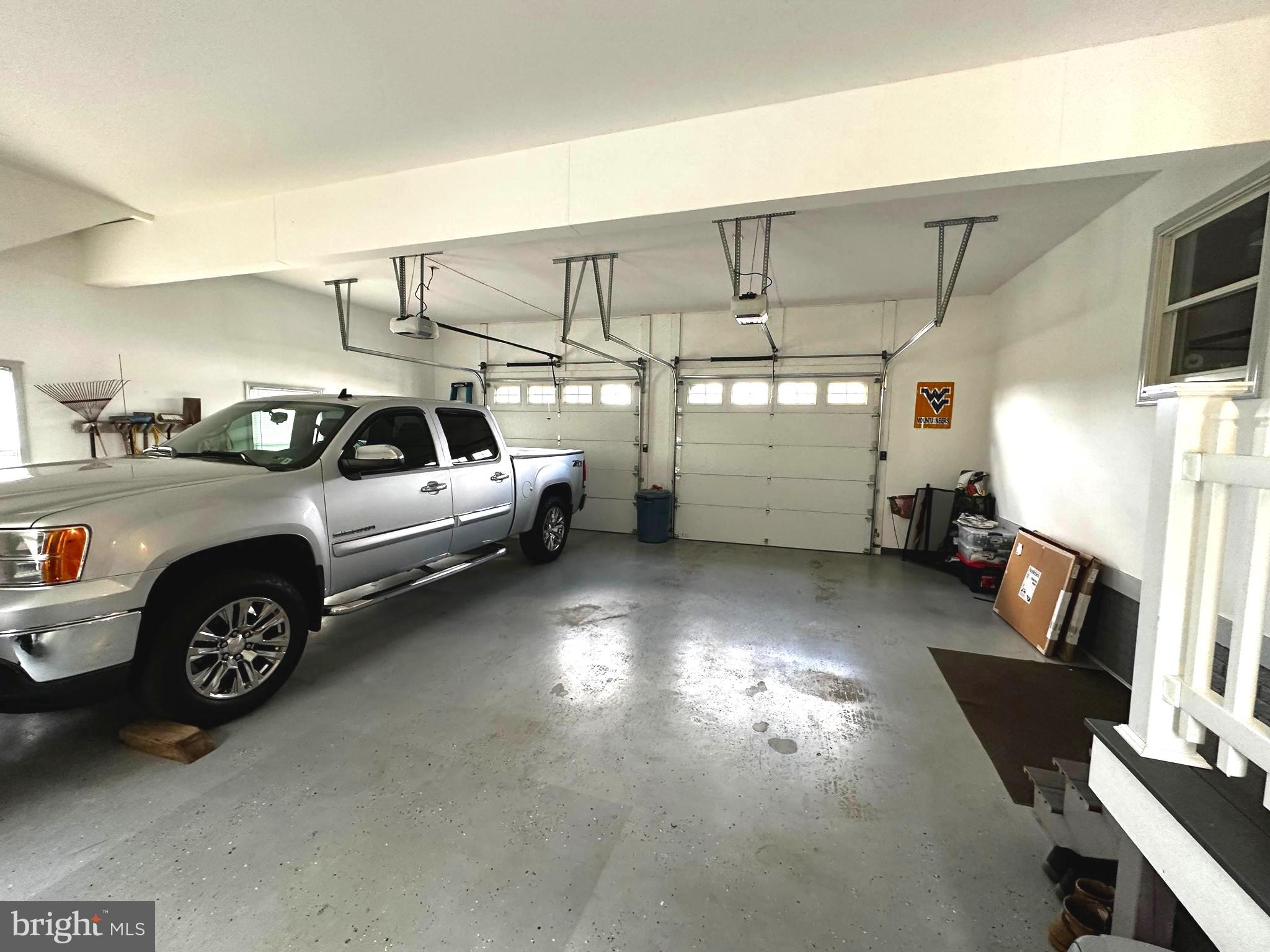 25 Mish Road Bunker Hill, WV 25413 - Photo 84 of 87 ATTACHED 2 CAR GARAGE w/ STAIRS TO ATTIC STORAGE