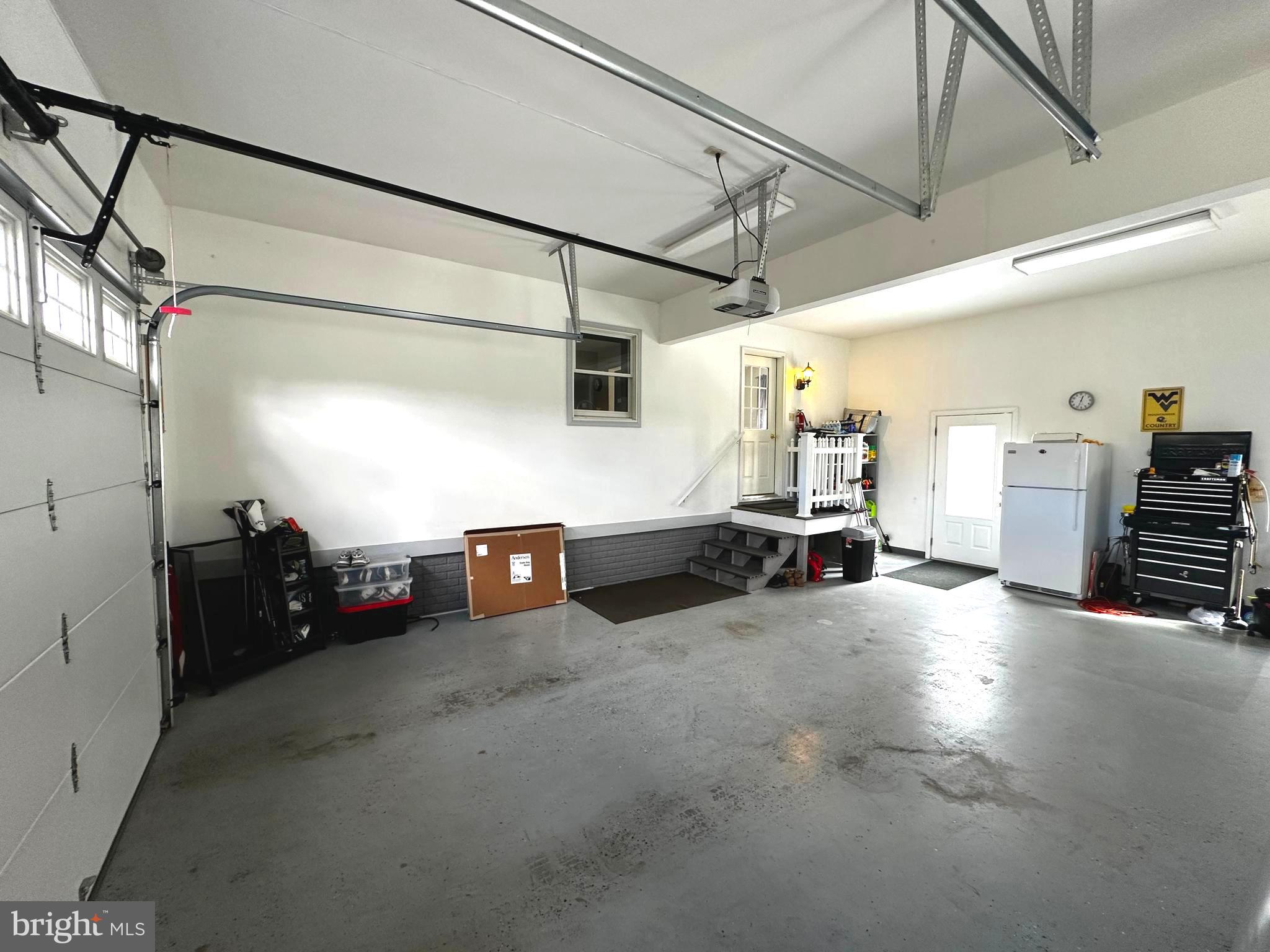 25 Mish Road Bunker Hill, WV 25413 - Photo 85 of 87 ATTACHED 2 CAR GARAGE w/ STAIRS TO ATTIC STORAGE