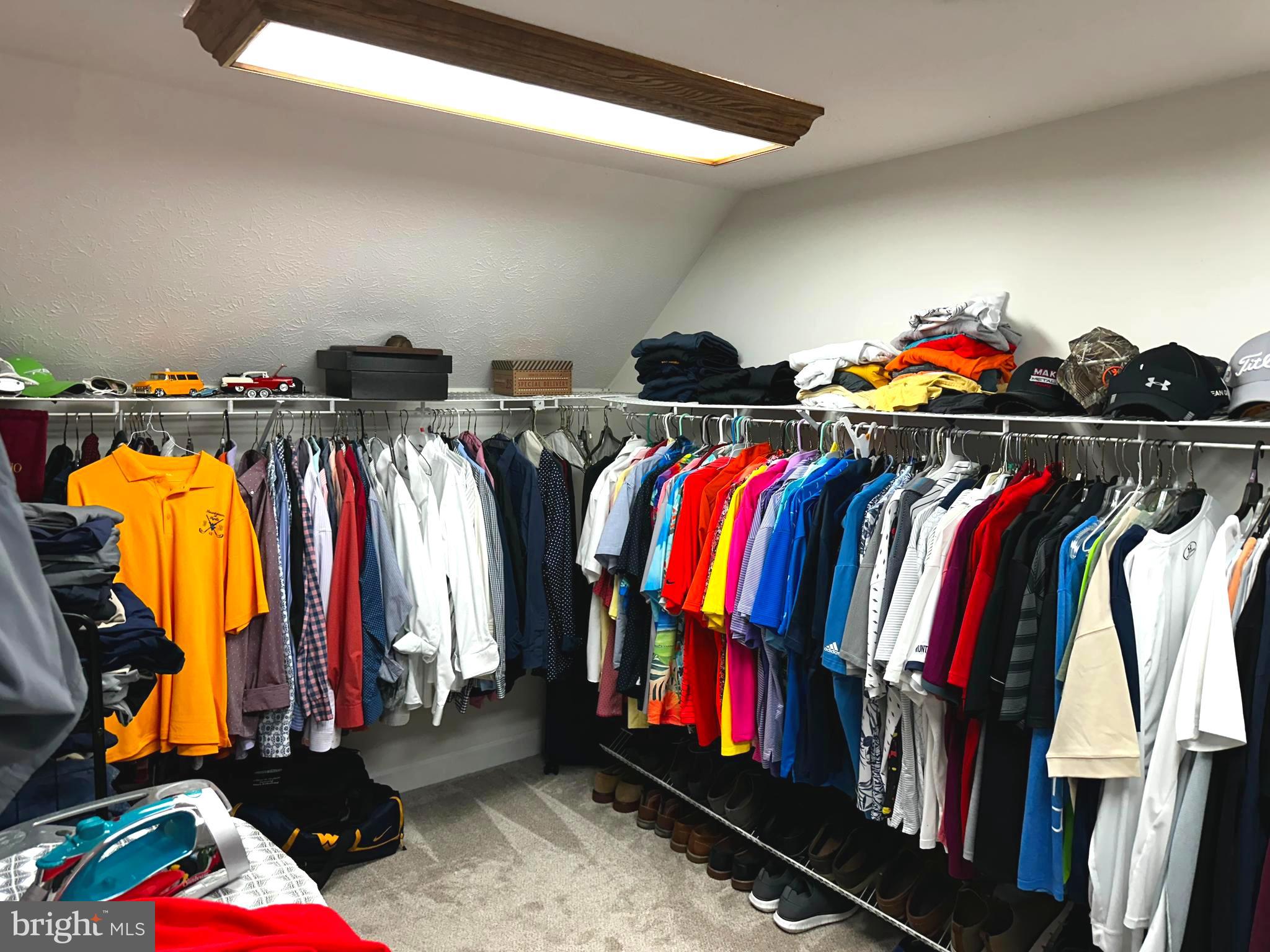 25 Mish Road Bunker Hill, WV 25413 - Photo 88 of 124 a view of walk in closet with clothes and shoes