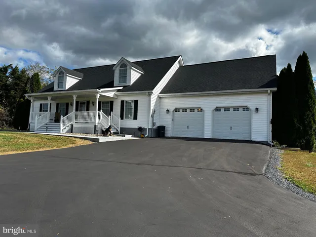 a view of a balcony with floor to ceiling windows and wooden floor