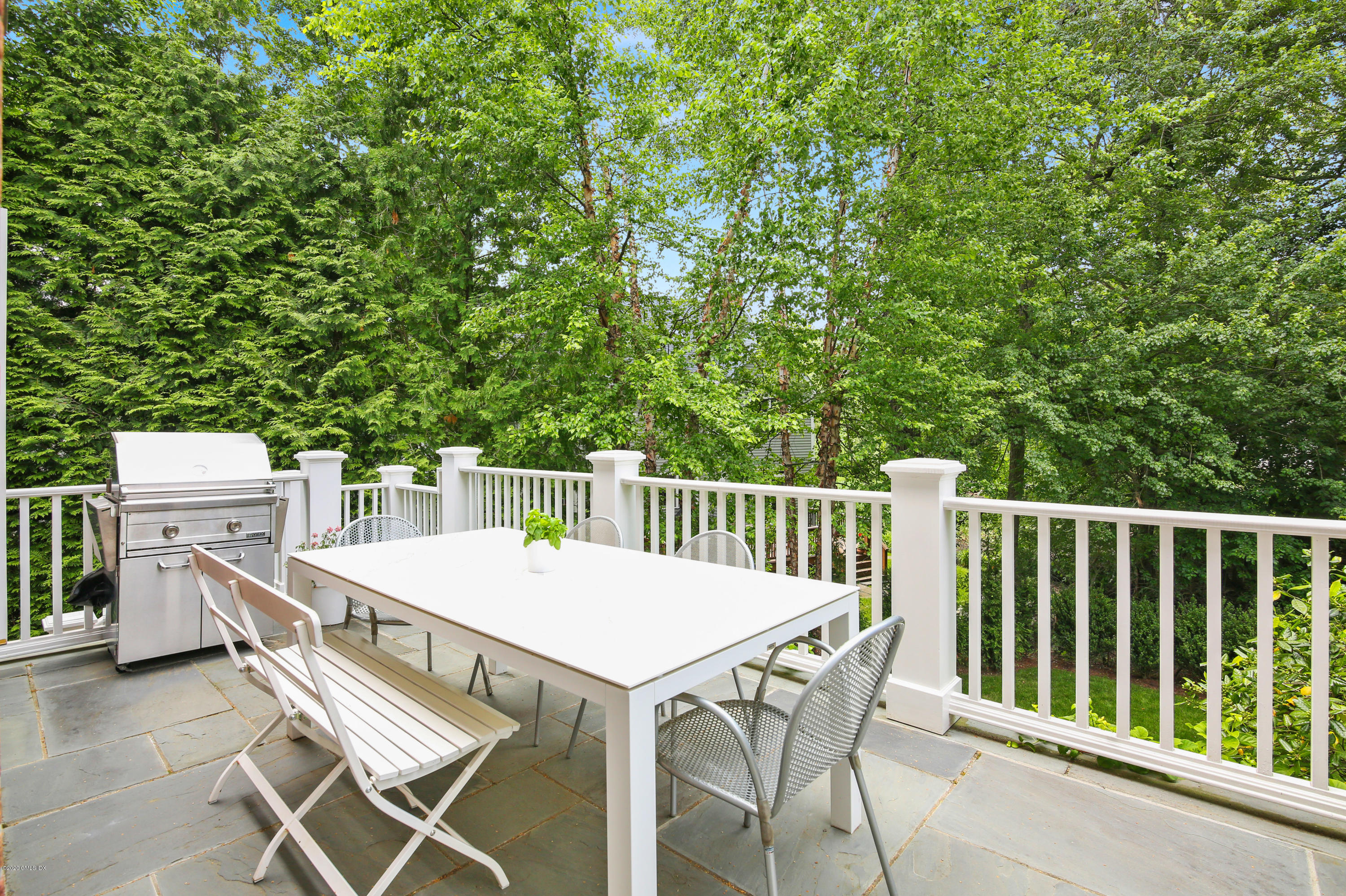67 Lockwood Road Riverside, CT 06878 - Photo 13 of 30 a balcony with a table and chairs