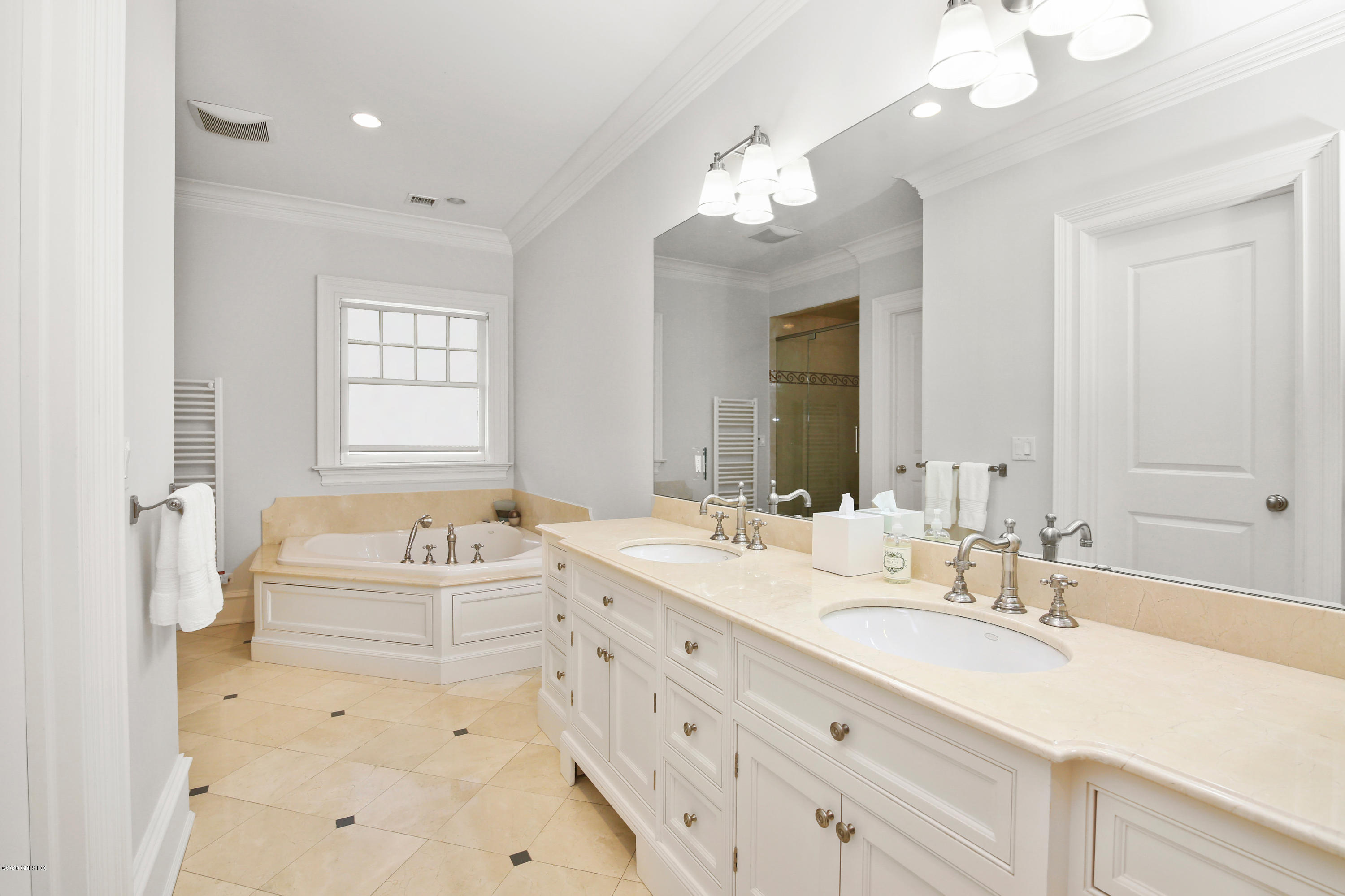 67 Lockwood Road Riverside, CT 06878 - Photo 16 of 30 a spacious bathroom with a double vanity sink mirror double and bathtub