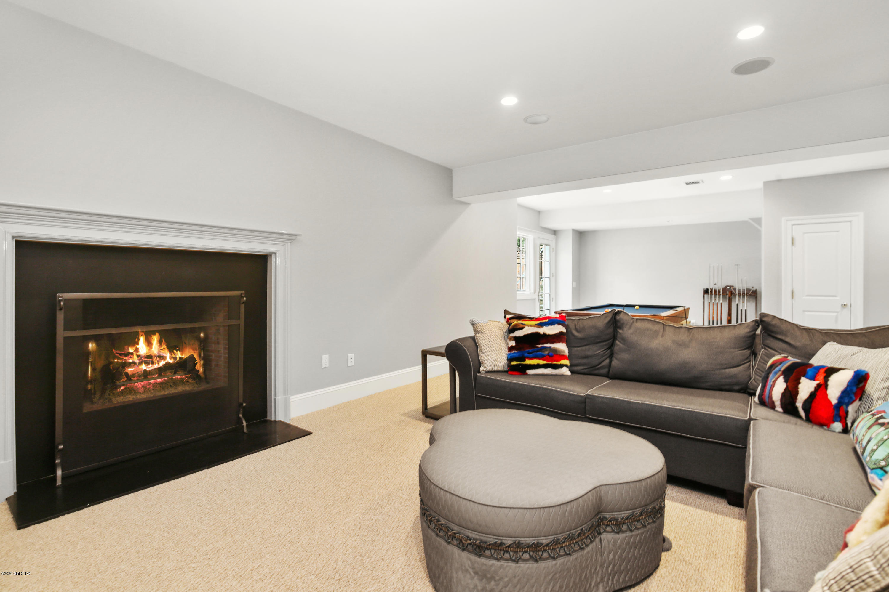 67 Lockwood Road Riverside, CT 06878 - Photo 23 of 30 a living room with furniture and a flat screen tv