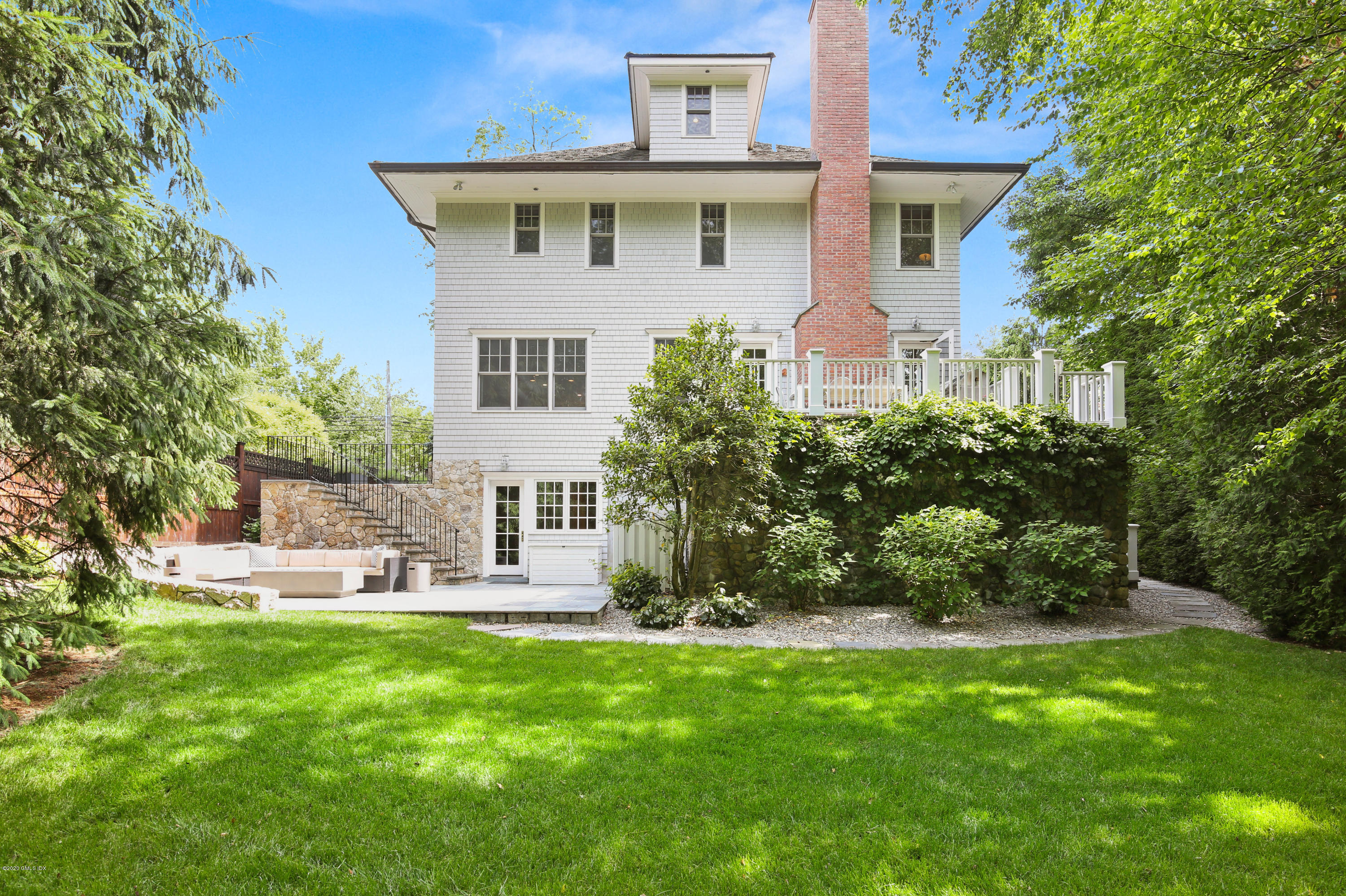 67 Lockwood Road Riverside, CT 06878 - Photo 27 of 30 a front view of a house with a yard and green space