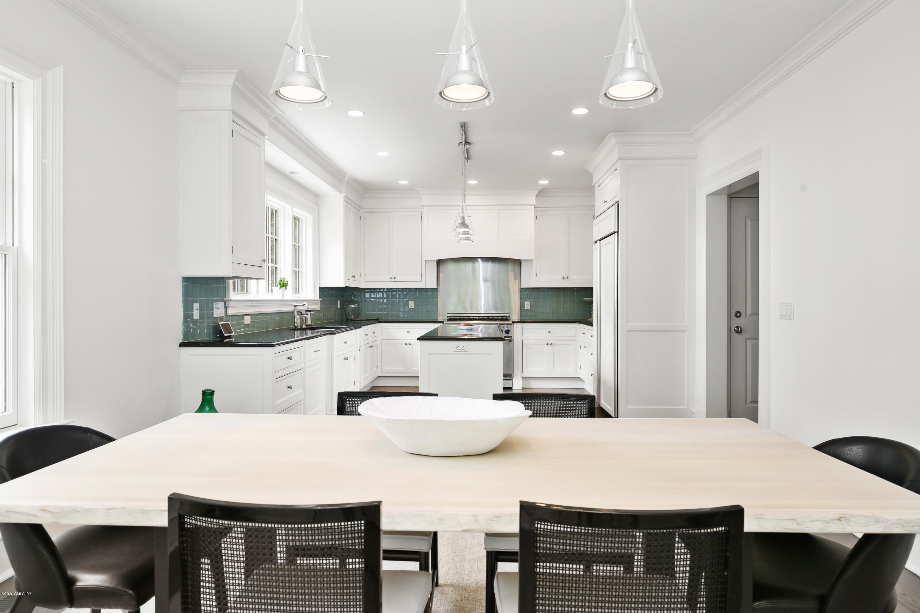 67 Lockwood Road Riverside, CT 06878 - Photo 8 of 30 a large kitchen with kitchen island a stove a table and chairs