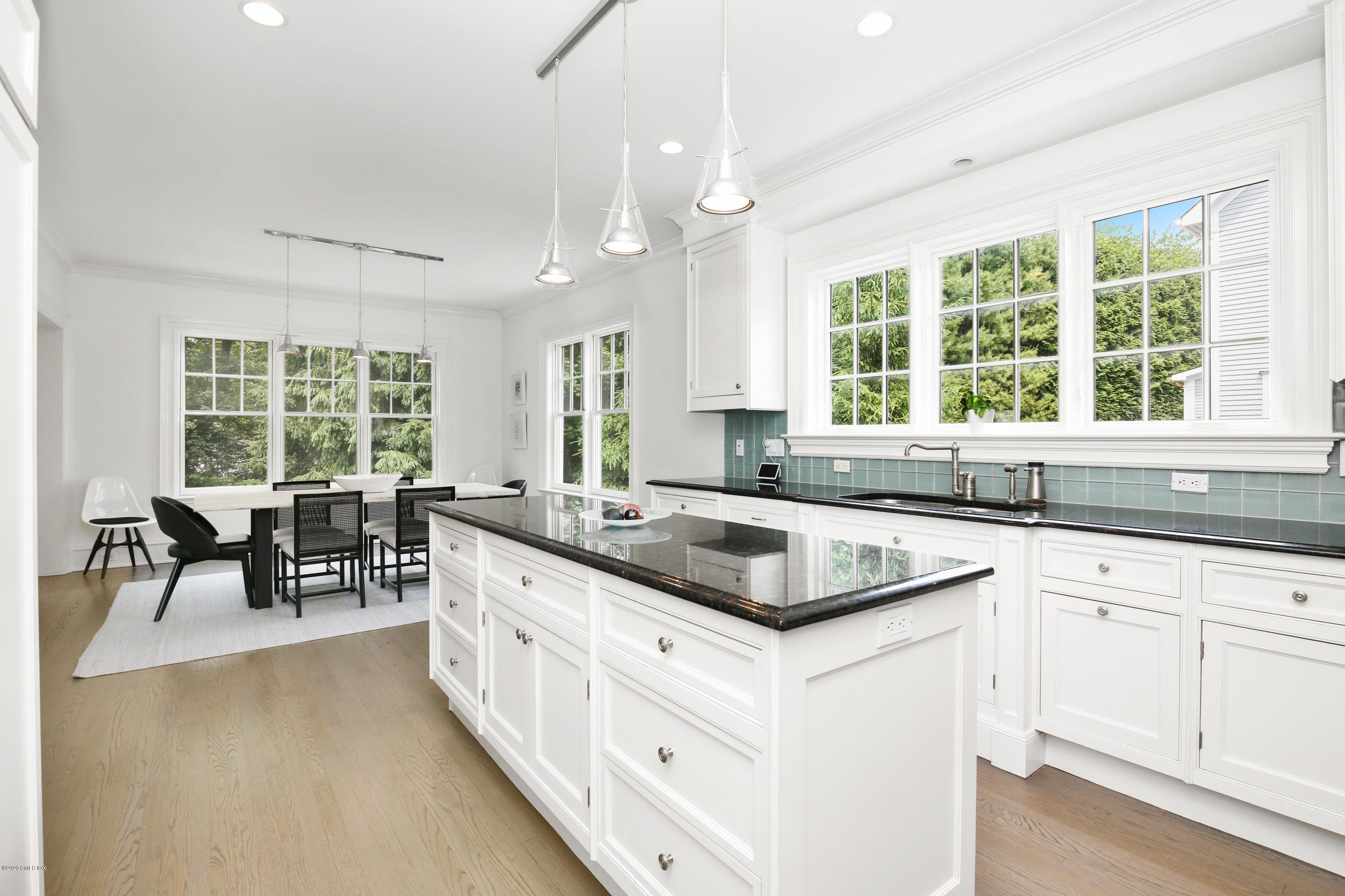 67 Lockwood Road Riverside, CT 06878 - Photo 9 of 30 a kitchen with stainless steel appliances granite countertop white cabinets and window